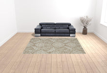 Blue And Ivory Wool Paisley Tufted Handmade Stain Resistant Area Rug - 5' x 8'