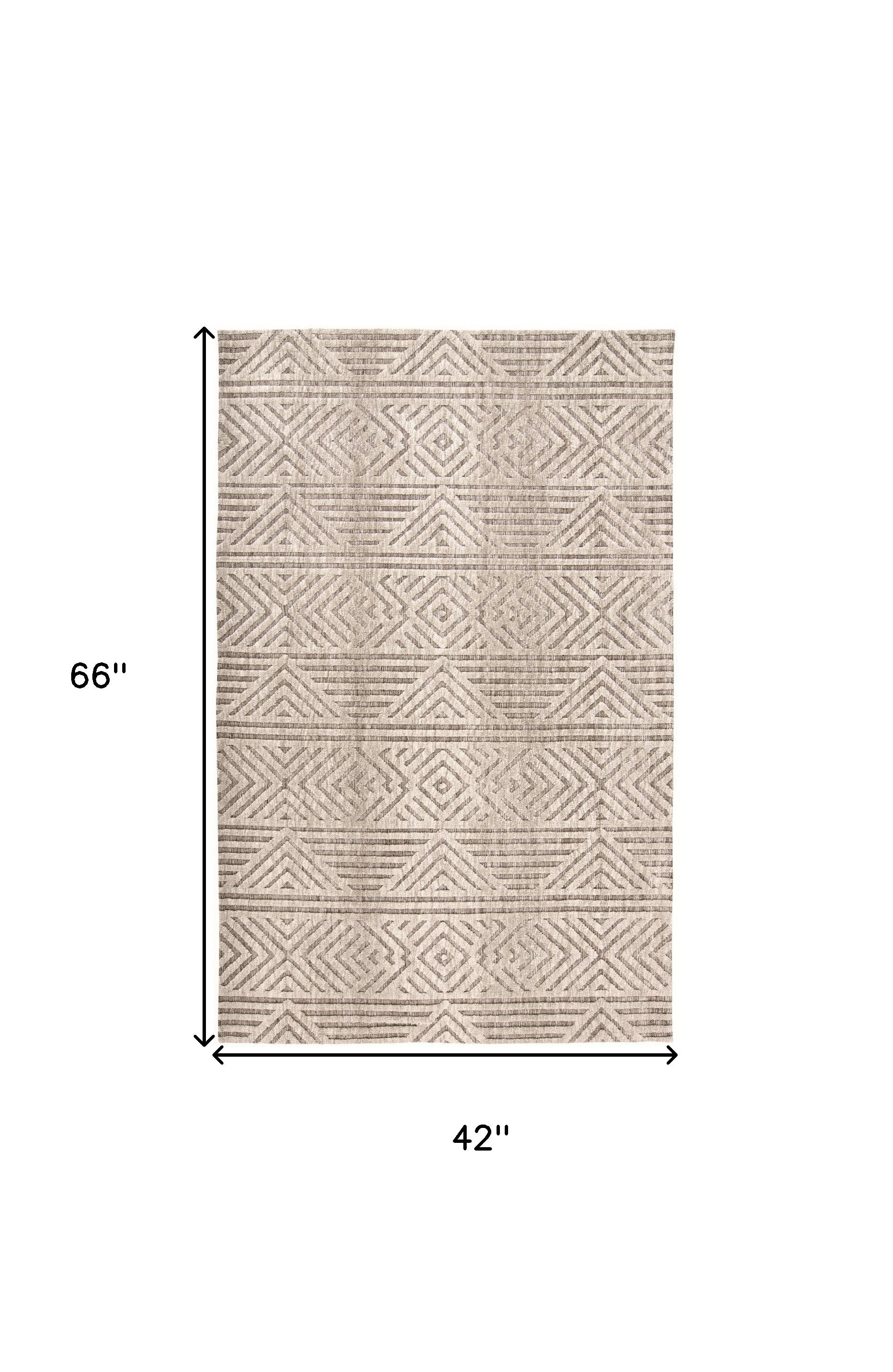 4' X 6' Tan Ivory And Brown Geometric Stain Resistant Area Rug