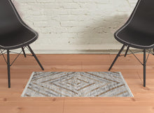 4' X 6' Ivory Gray And Tan Geometric Hand Woven Stain Resistant Area Rug With Fringe