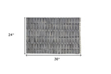 4' X 6' Gray Silver And Ivory Geometric Hand Woven Stain Resistant Area Rug With Fringe