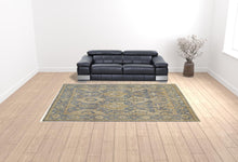 4' X 6' Blue Gold And Tan Wool Floral Hand Knotted Stain Resistant Area Rug With Fringe