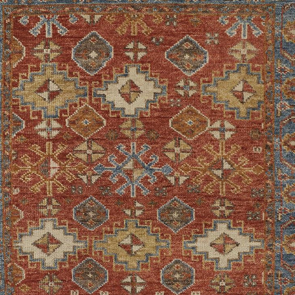 4' X 6' Red Blue And Orange Wool Floral Hand Knotted Stain Resistant Area Rug With Fringe