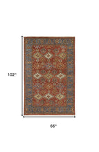 4' X 6' Red Blue And Orange Wool Floral Hand Knotted Stain Resistant Area Rug With Fringe