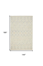 Ivory Blue And Tan Wool Geometric Tufted Handmade Stain Resistant Area Rug - 4' x 6'