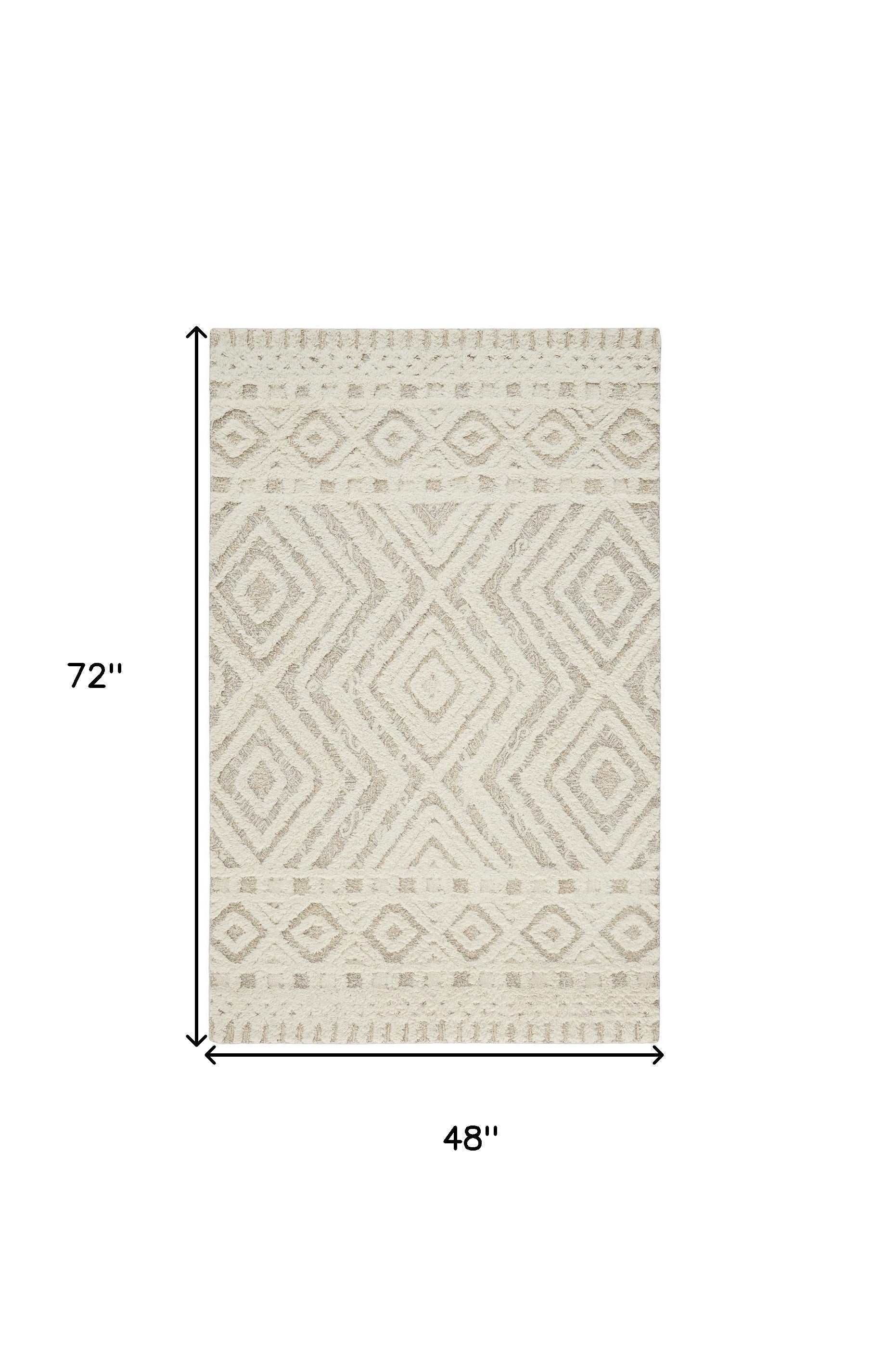 Ivory And Tan Wool Geometric Tufted Handmade Stain Resistant Area Rug - 4' x 6'