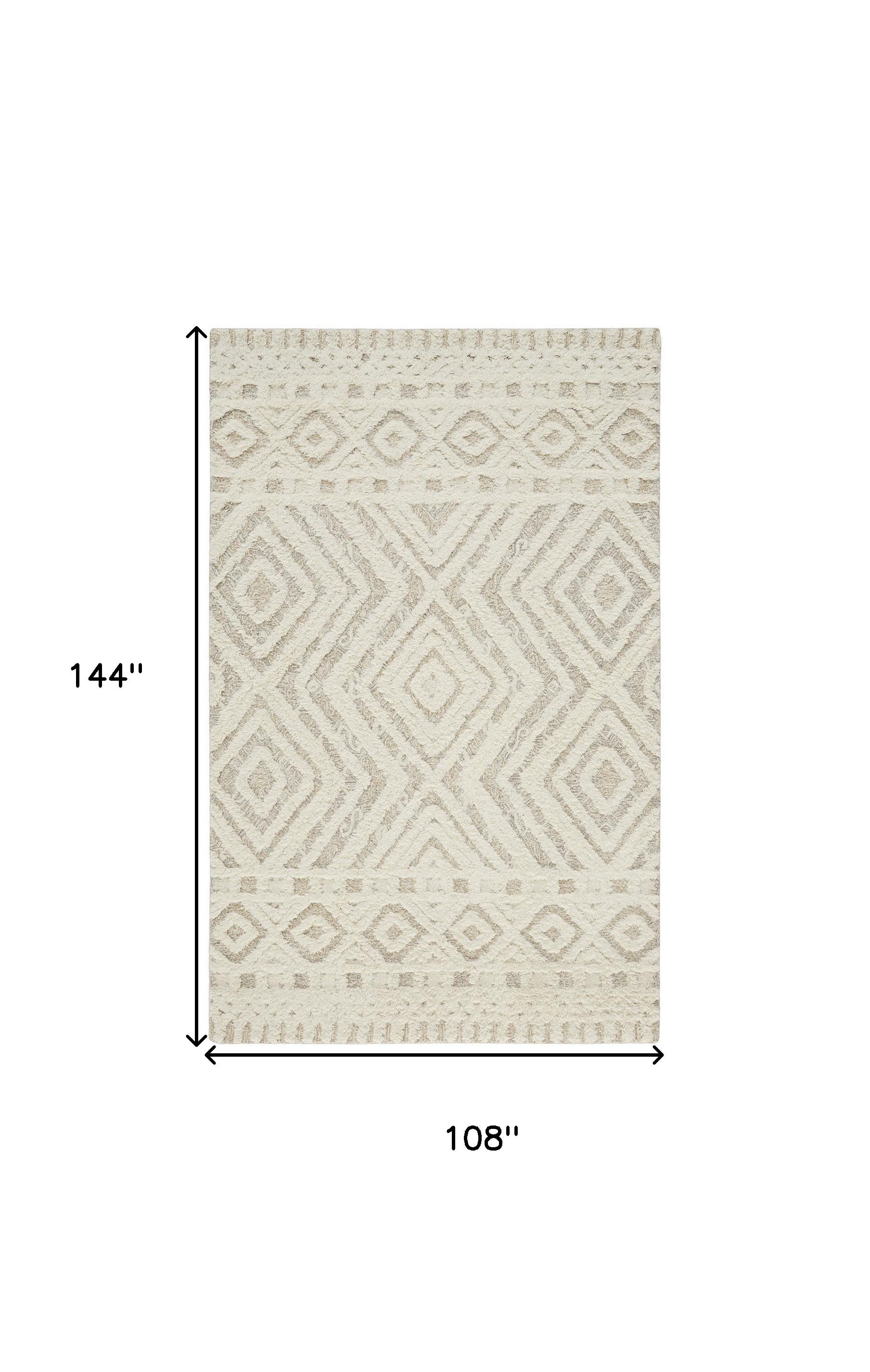 Ivory And Tan Wool Geometric Tufted Handmade Stain Resistant Area Rug - 4' x 6'