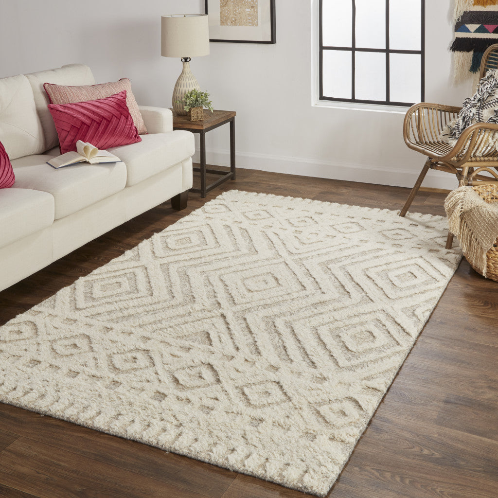 Ivory And Tan Wool Geometric Tufted Handmade Stain Resistant Area Rug - 4' x 6'