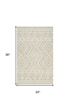 Ivory And Tan Wool Geometric Tufted Handmade Stain Resistant Area Rug - 4' x 6'