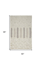 Ivory Taupe And Tan Wool Geometric Tufted Handmade Stain Resistant Area Rug - 4' x 6'