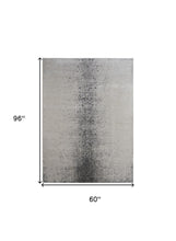 4' X 6' Ivory And Blue Abstract Power Loom Area Rug