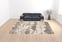 4' X 6' Gray Ivory And Gold Abstract Area Rug
