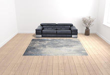 4' X 6' Gray Blue And Ivory Abstract Area Rug