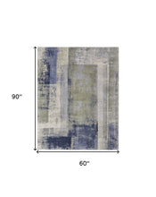 4' X 6' Blue Green And Ivory Abstract Power Loom Distressed Area Rug