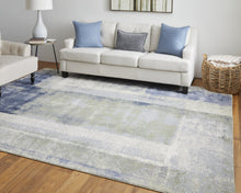 4' X 6' Blue Green And Ivory Abstract Power Loom Distressed Area Rug