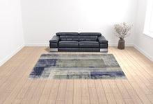 4' X 6' Blue Green And Ivory Abstract Power Loom Distressed Area Rug