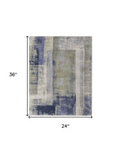 4' X 6' Blue Green And Ivory Abstract Power Loom Distressed Area Rug