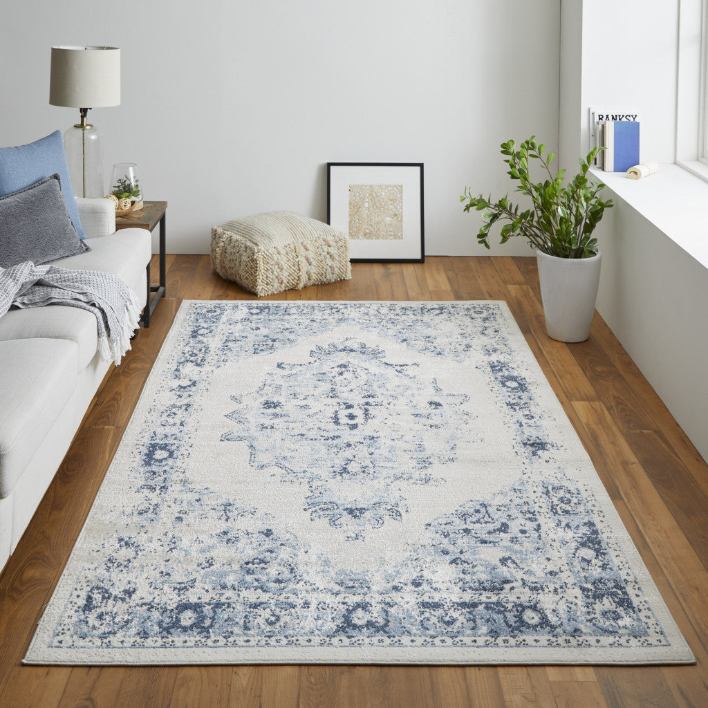 4' X 6' Ivory And Blue Floral Power Loom Distressed Area Rug