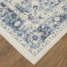 4' X 6' Ivory And Blue Floral Power Loom Distressed Area Rug