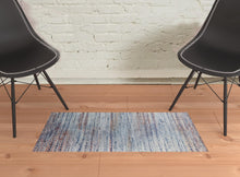 3' X 5' Blue Ivory And Orange Abstract Power Loom Stain Resistant Area Rug