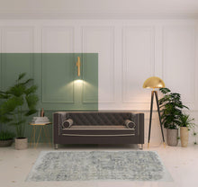 4' X 6' Green Blue And Ivory Abstract Hand Woven Distressed Area Rug