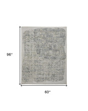 4' X 6' Green Blue And Ivory Abstract Hand Woven Distressed Area Rug