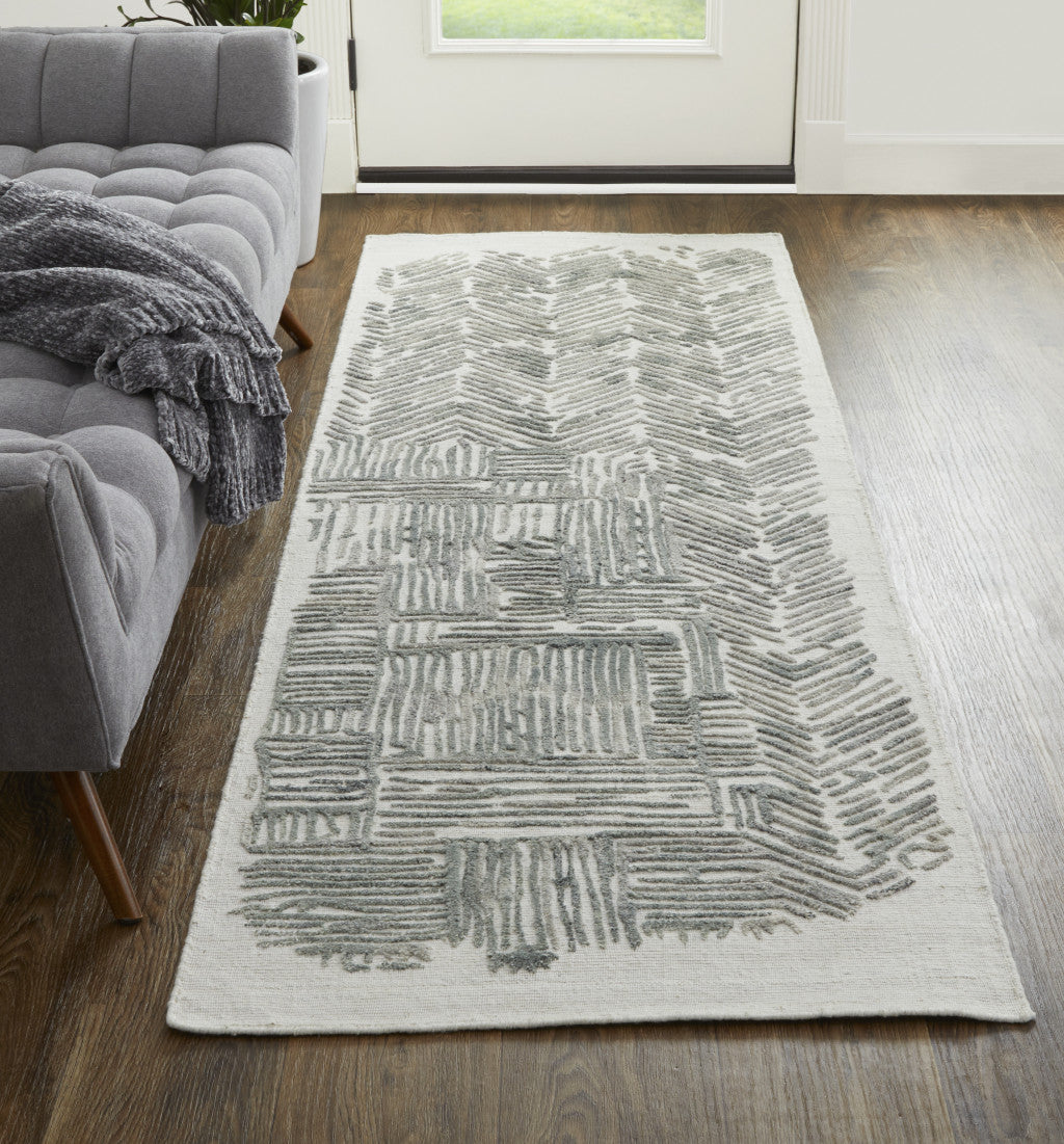 4' X 6' Green Blue And Ivory Abstract Hand Woven Distressed Area Rug