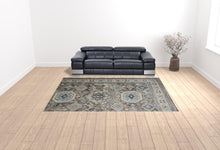 5' X 8' Gray Brown And Blue Floral Stain Resistant Area Rug