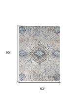 5' X 8' Ivory Taupe And Blue Floral Power Loom Distressed Stain Resistant Area Rug