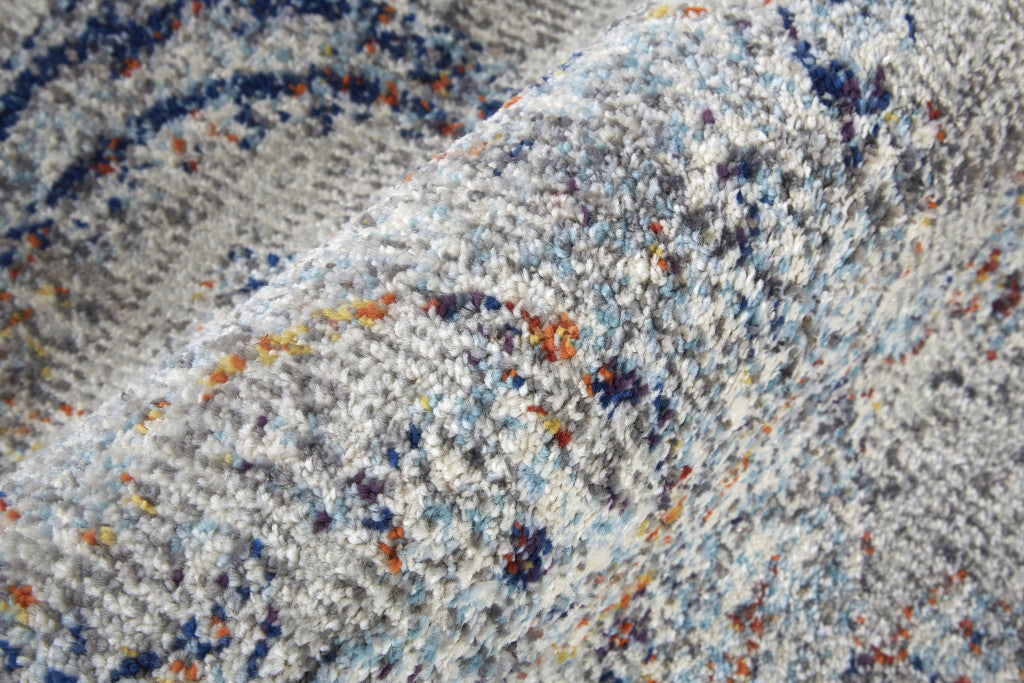 5' X 8' Ivory Taupe And Blue Floral Power Loom Distressed Stain Resistant Area Rug