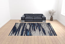 4' X 6' Ivory Blue And Gray Abstract Power Loom Distressed Area Rug