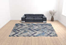 10' X 13' Ivory Blue And Gray Chevron Power Loom Distressed Area Rug