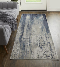 4' X 6' Ivory Blue And Black Abstract Power Loom Distressed Area Rug