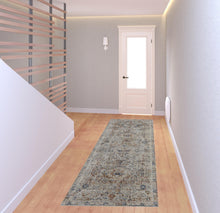 5' X 8' Tan Orange And Red Floral Power Loom Distressed Area Rug With Fringe