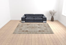 5' X 8' Tan Ivory And Orange Floral Power Loom Distressed Area Rug With Fringe