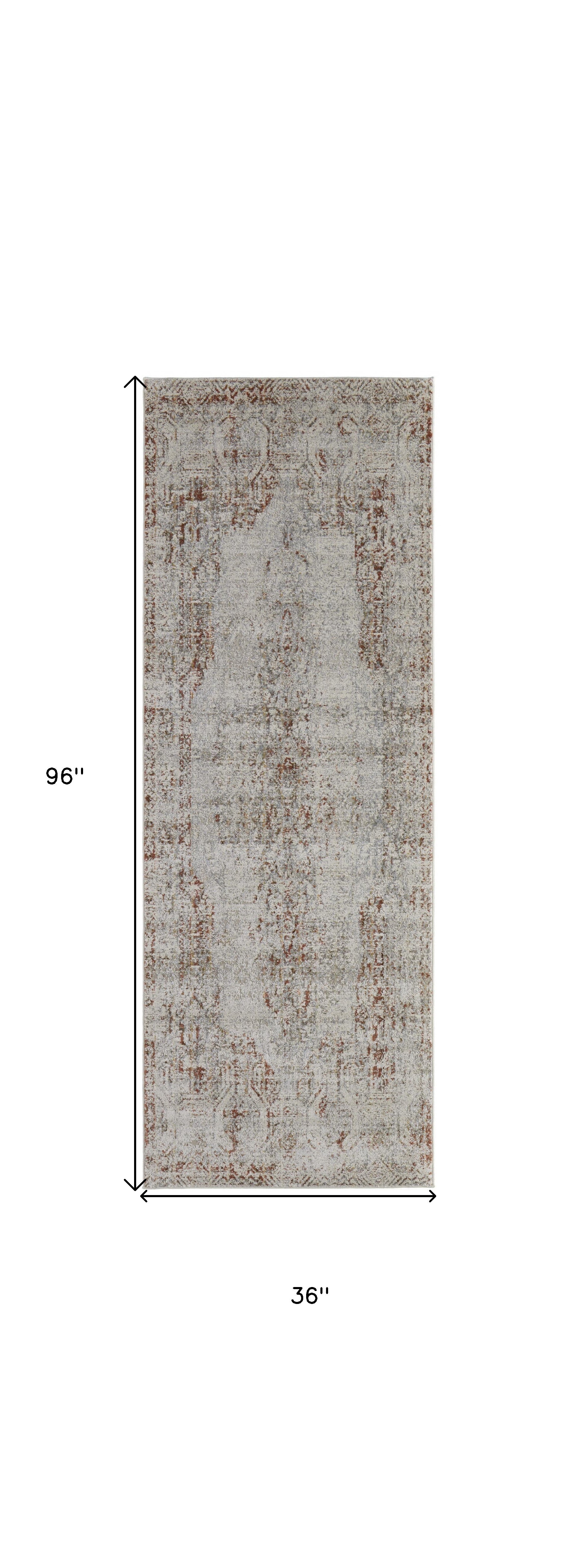 5' X 8' Tan Ivory And Orange Floral Power Loom Distressed Area Rug With Fringe