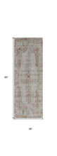 5' X 8' Tan Ivory And Orange Floral Power Loom Distressed Area Rug With Fringe