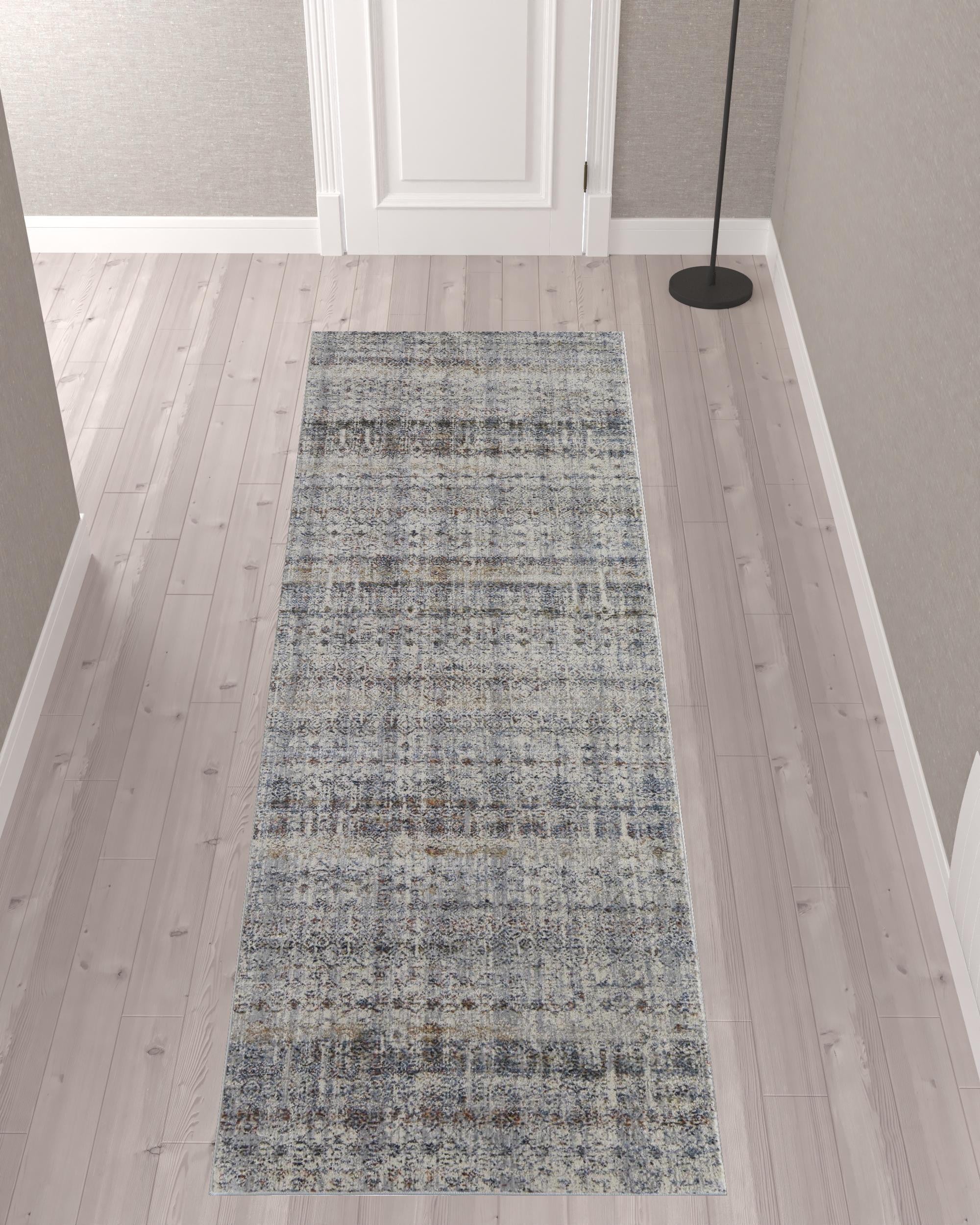 5' X 8' Tan Ivory And Blue Geometric Power Loom Distressed Area Rug With Fringe