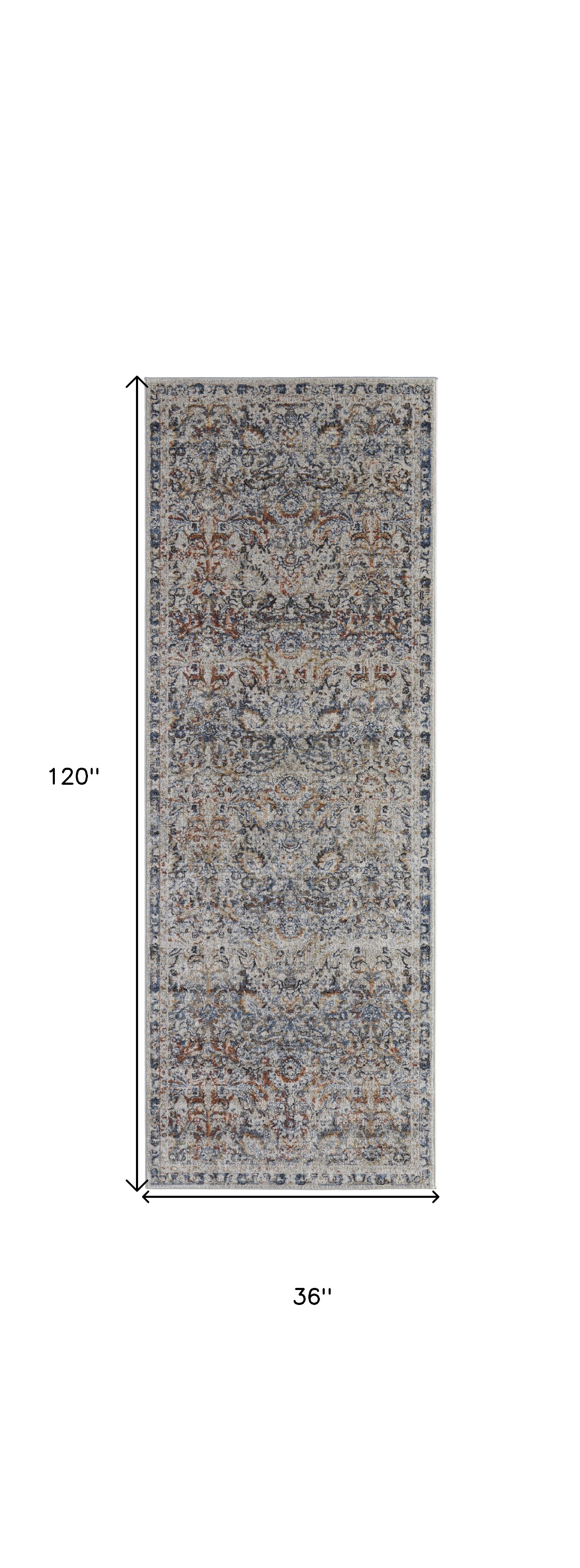 5' X 8' Tan Blue And Orange Floral Power Loom Distressed Area Rug With Fringe