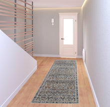 5' X 8' Tan Blue And Orange Floral Power Loom Distressed Area Rug With Fringe