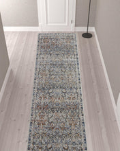 5' X 8' Tan Blue And Orange Floral Power Loom Distressed Area Rug With Fringe