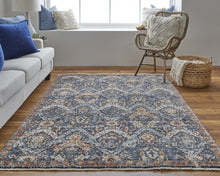 5' X 8' Blue Orange And Ivory Floral Power Loom Area Rug With Fringe