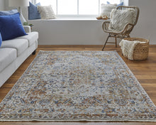 5' X 8' Tan Ivory And Orange Floral Power Loom Area Rug With Fringe