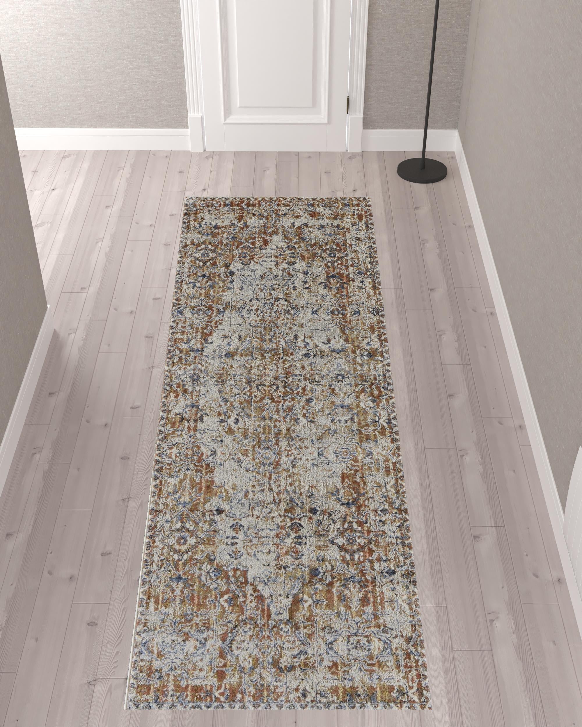 5' X 8' Tan Ivory And Orange Floral Power Loom Area Rug With Fringe