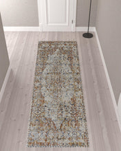 5' X 8' Tan Ivory And Orange Floral Power Loom Area Rug With Fringe