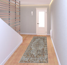 5' X 8' Tan Ivory And Orange Floral Power Loom Area Rug With Fringe