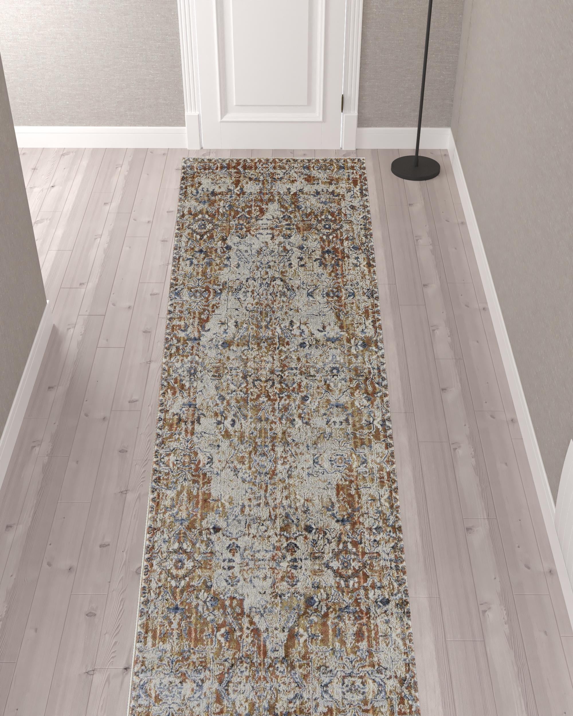 5' X 8' Tan Ivory And Orange Floral Power Loom Area Rug With Fringe