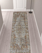 5' X 8' Tan Ivory And Orange Floral Power Loom Area Rug With Fringe