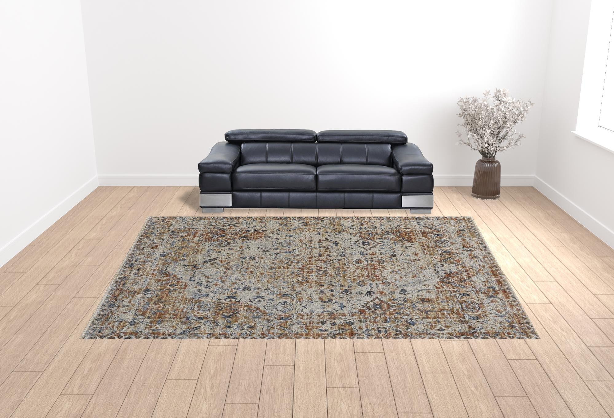 5' X 8' Tan Ivory And Orange Floral Power Loom Area Rug With Fringe