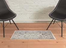 4' X 6' Tan Ivory And Blue Floral Stain Resistant Area Rug