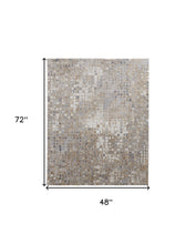 4' X 6' Tan Ivory And Blue Geometric Power Loom Distressed Area Rug